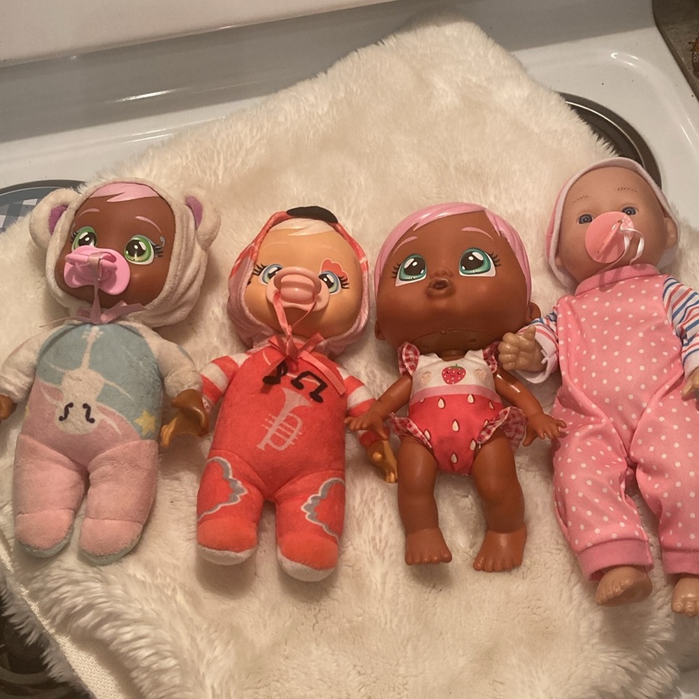 Baby doll bundle of four with pacifiers